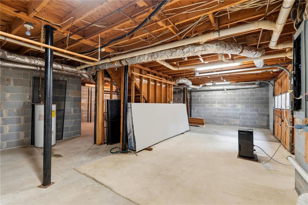 3121 Bonds Lake Road Northwest Conyers, GA 30012 - Photo 27 of 36 a view of an empty room with wooden walls