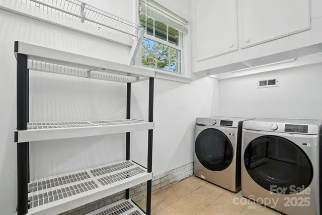 a view of livingroom with washer and dryer
