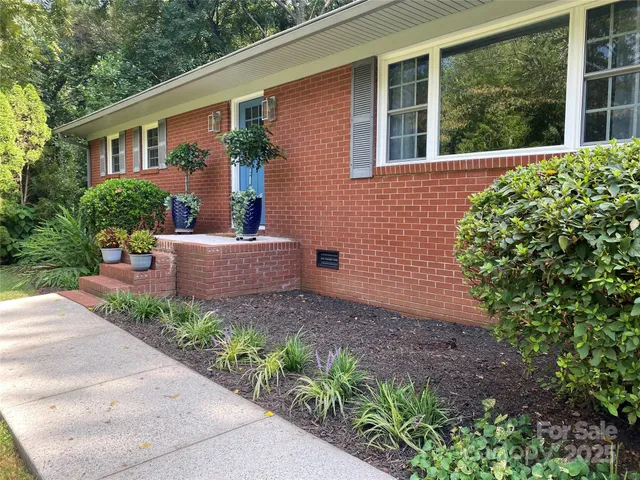 a house view with a garden space
