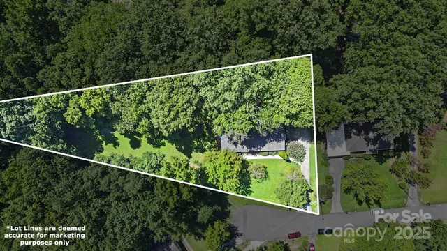 an aerial view of house with yard