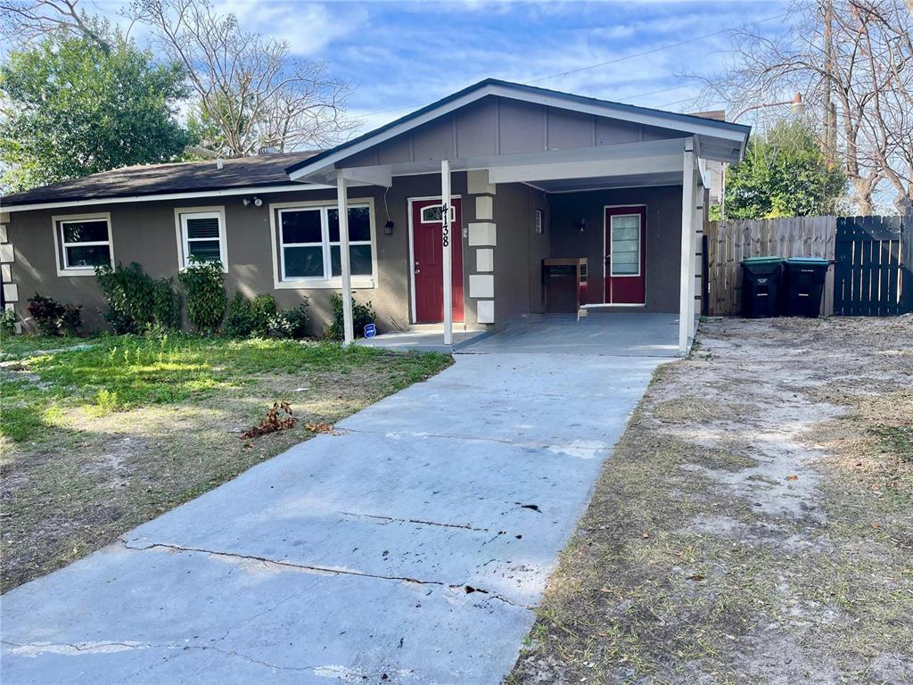 4138 Westgate Road Orlando, FL 32808 - Photo 2 of 29 a view of a house with backyard and porch