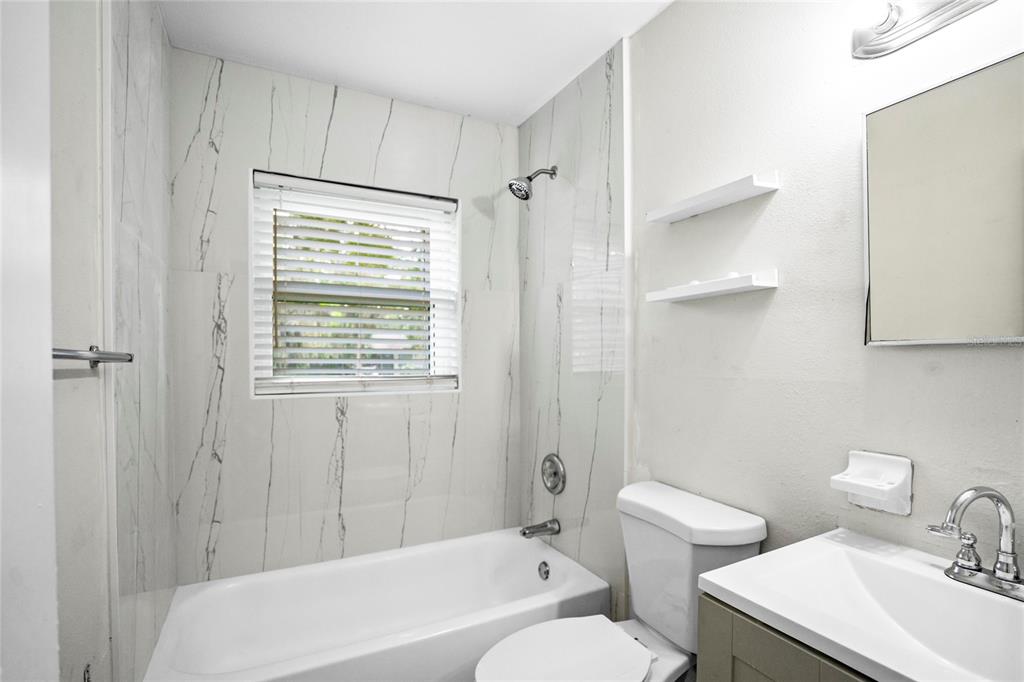 4138 Westgate Road Orlando, FL 32808 - Photo 23 of 29 a bathroom with a sink toilet and shower