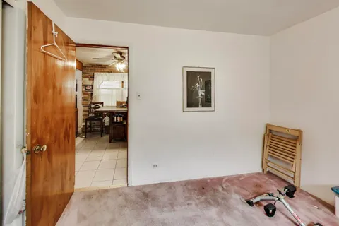 a bedroom with furniture and a window