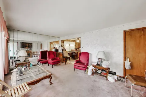 a living room with furniture gym equipment and a view of living room