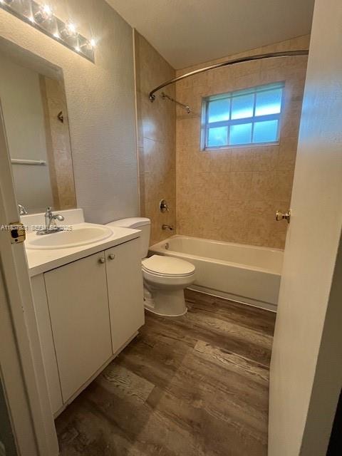 3985 Northwest 165th Street Miami Gardens, FL 33054 - Photo 7 of 9 a bathroom with a sink a toilet and shower