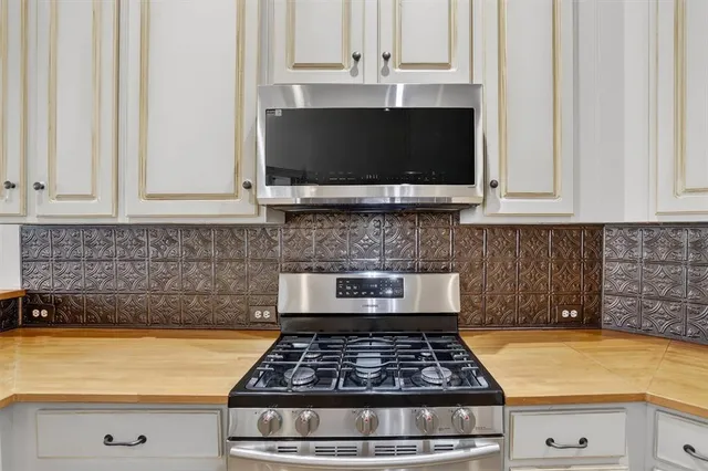 a kitchen with a stove and a microwave