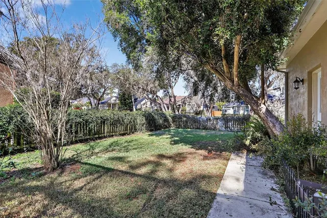 a backyard of a house with lots of green space