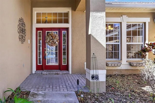 a view of a brick building with a door and a window