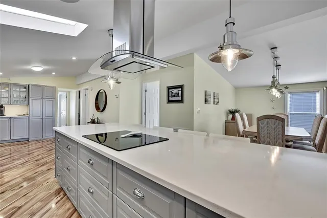 a kitchen with stainless steel appliances a refrigerator and cabinets