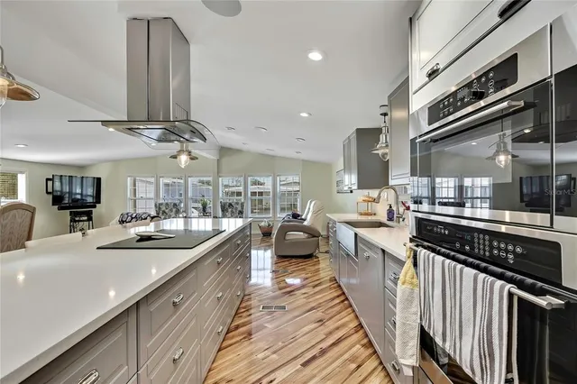 a large bedroom with a bed and a large mirror