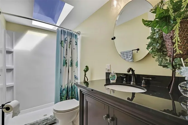 a bedroom with two beds and a window