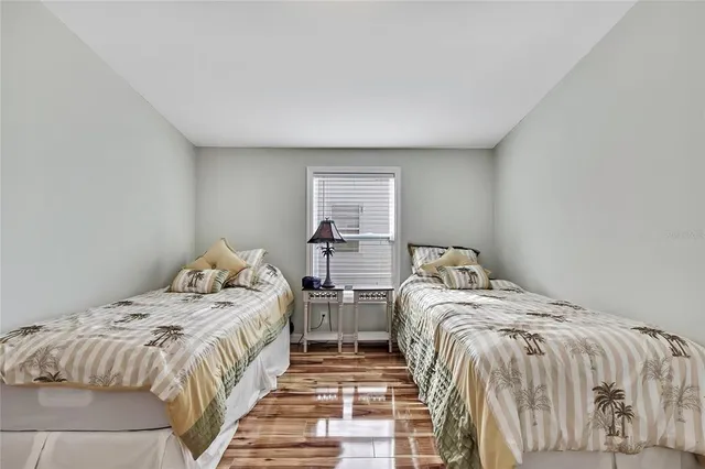 a living room with furniture and large windows