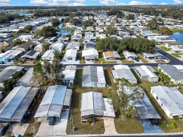 an aerial view of a house with a lake view