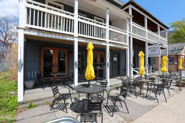 a view of a dinning tables and chairs in patio