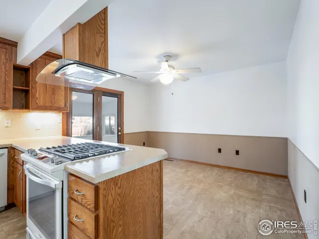 a kitchen that has a lot of cabinets in it