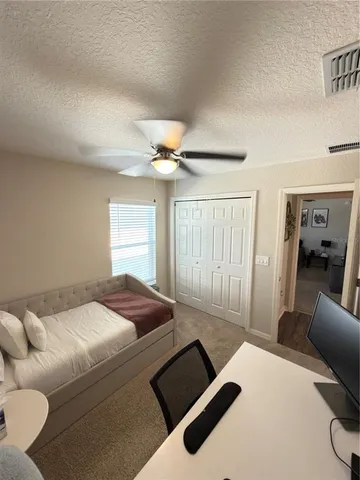 a bedroom with a bed and window