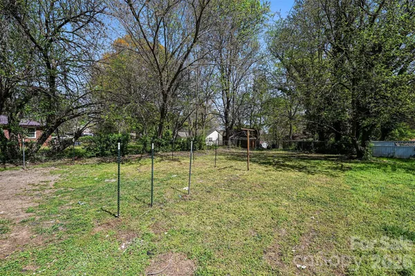 a view of a park with large trees