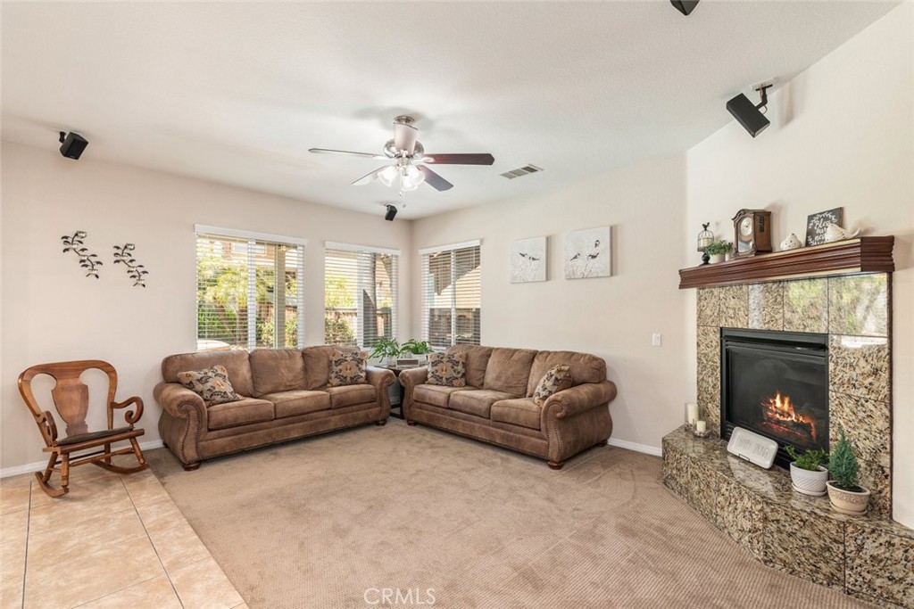 46123 Drymen Avenue Temecula, CA 92592 - Photo 12 of 42 a living room with furniture and a fireplace