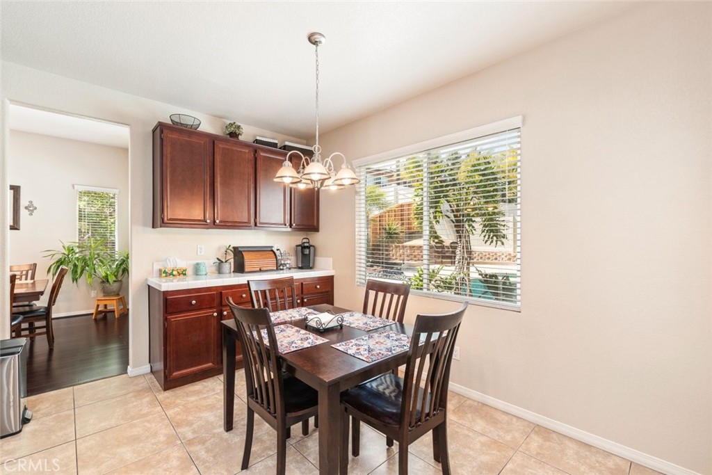 46123 Drymen Avenue Temecula, CA 92592 - Photo 16 of 42 a view of a dining room with furniture window and outside view