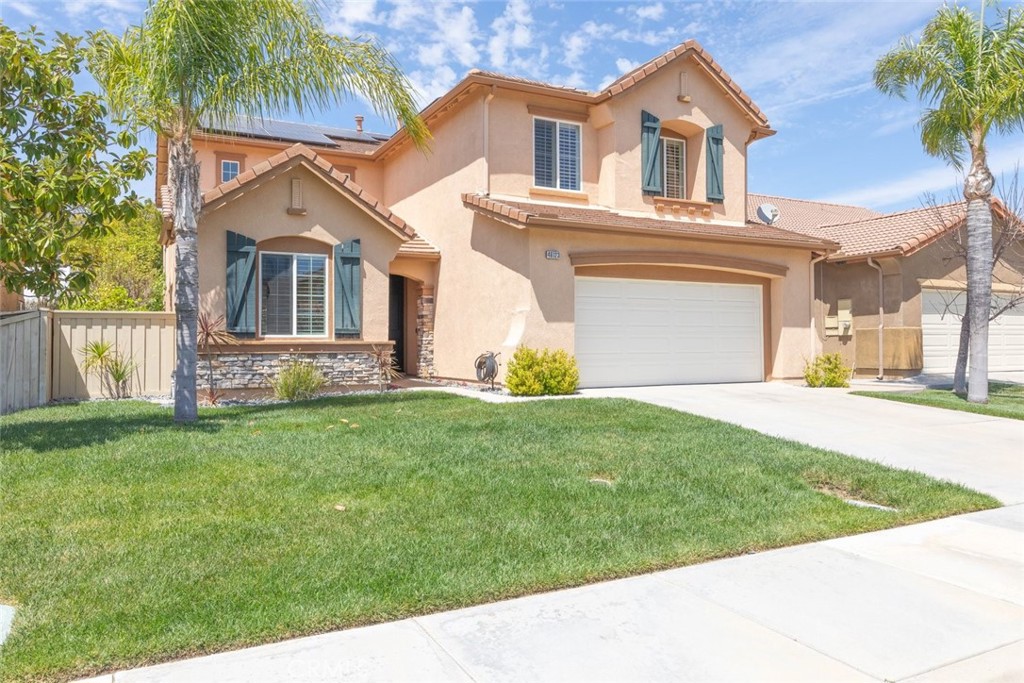 46123 Drymen Avenue Temecula, CA 92592 - Photo 2 of 42 a front view of a house with a yard and garage