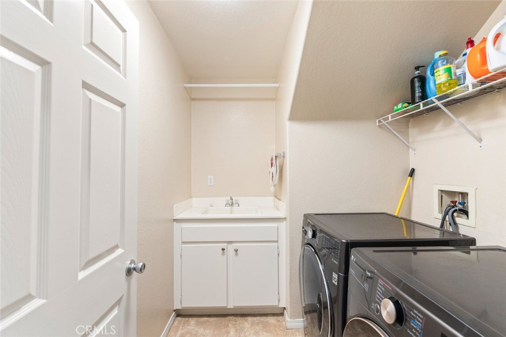 46123 Drymen Avenue Temecula, CA 92592 - Photo 21 of 42 a utility room with dryer and washer