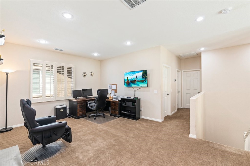 46123 Drymen Avenue Temecula, CA 92592 - Photo 22 of 42 a living room with furniture and a flat screen tv