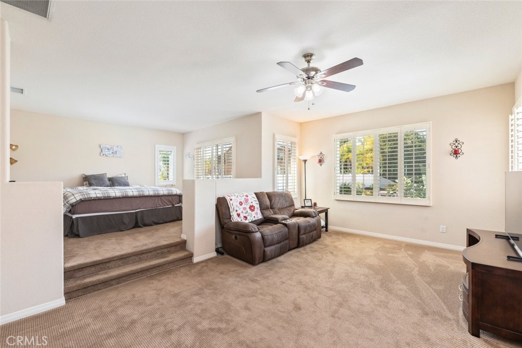 46123 Drymen Avenue Temecula, CA 92592 - Photo 26 of 42 a living room with furniture and a large window
