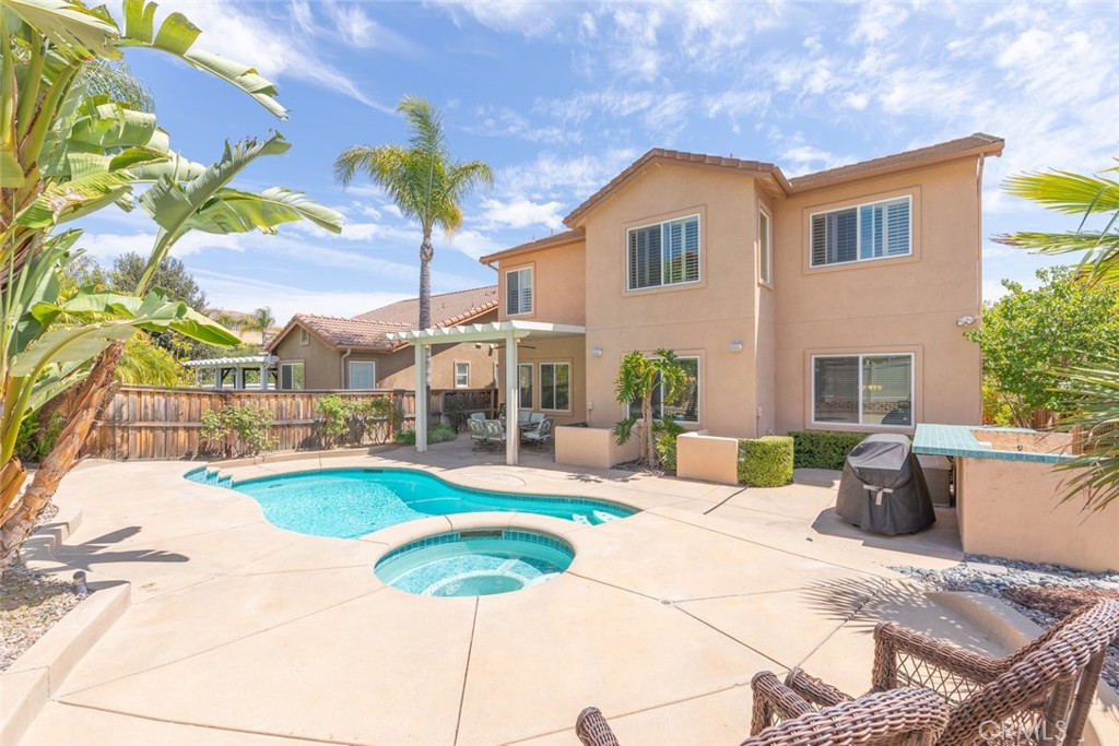 46123 Drymen Avenue Temecula, CA 92592 - Photo 33 of 42 a view of a house with backyard and sitting area