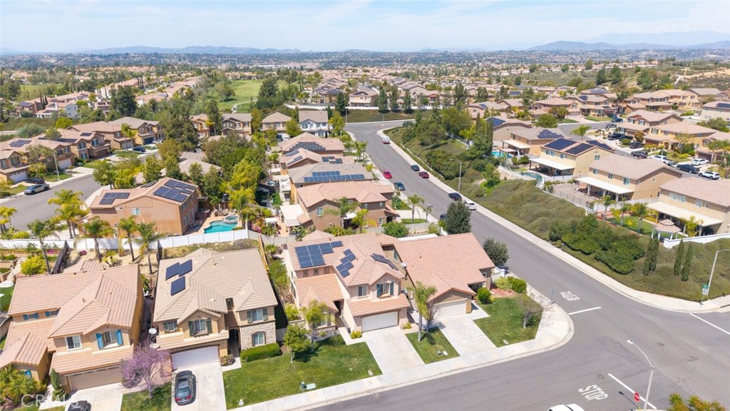 46123 Drymen Avenue Temecula, CA 92592 - Photo 38 of 42 an aerial view of residential building with parking