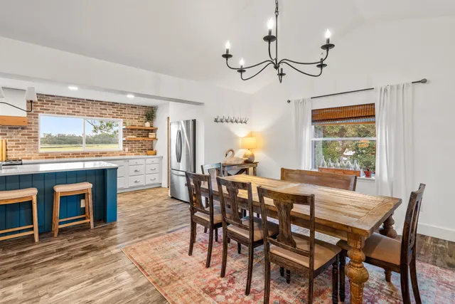 a large kitchen with kitchen island a sink dishwasher a stove and a refrigerator