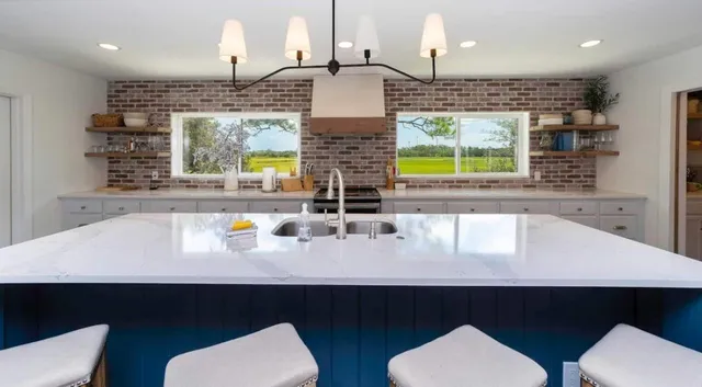 a bathroom with a toilet a sink and bathtub