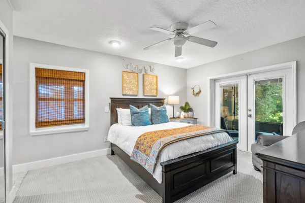 a bedroom with a bed and a television