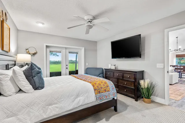 a view of a patio with a dining table and chairs