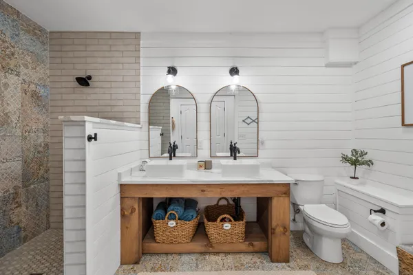a bathroom with a sink and mirror
