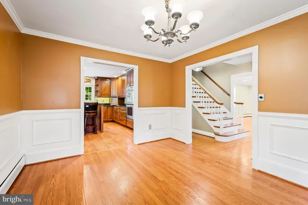 a large kitchen with stainless steel appliances granite countertop a stove and a sink