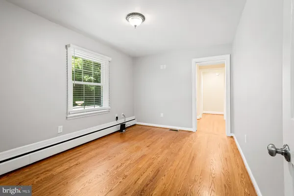 a kitchen with a refrigerator and a sink