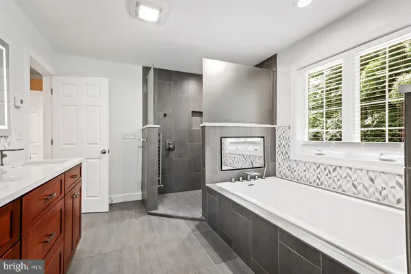 a bathroom with a glass shower door