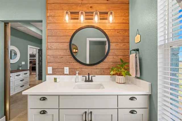 a bathroom with a sink and a mirror