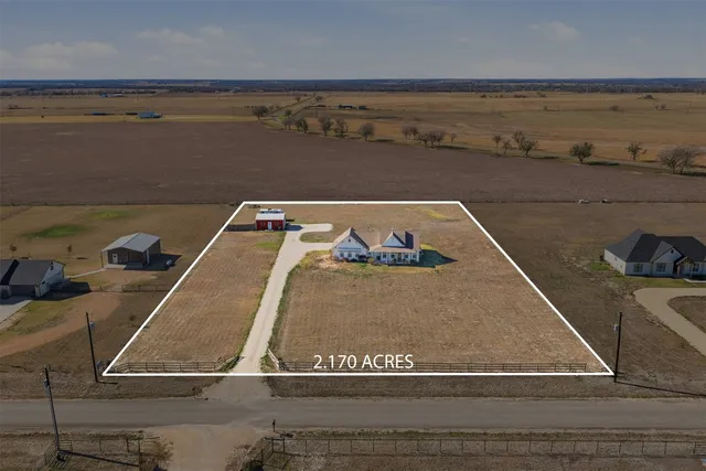 a view of a room with an empty space and lots of countertop