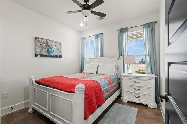 a bed room with a bed and a tv