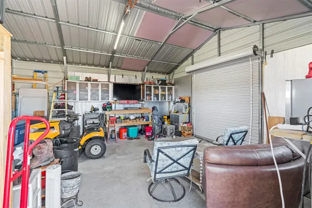 a view of a house with a garden and lake view