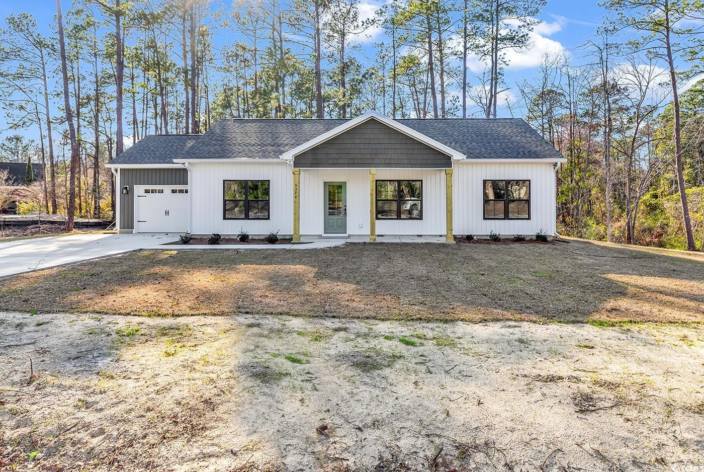 5374 Hampton Road Conway, SC 29527 - Photo 1 of 13 Modern farmhouse with concrete driveway, roof with