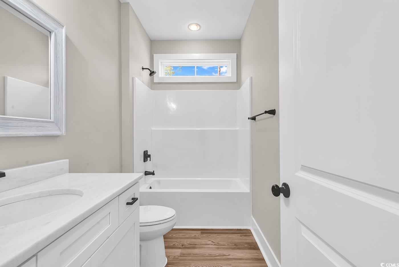 5374 Hampton Road Conway, SC 29527 - Photo 8 of 13 Bathroom with shower combination, vanity, wood fi