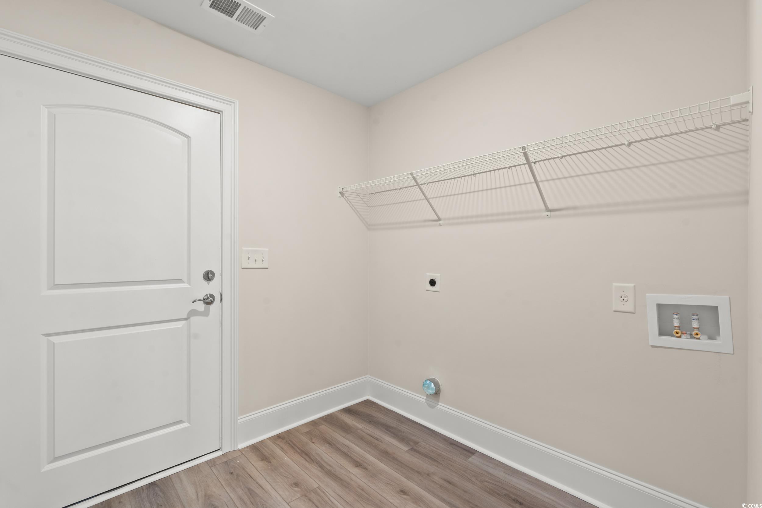 4022 Macks Road Aynor, SC 29511 - Photo 14 of 35 Laundry room featuring electric dryer hookup, baseboards, wood finished floors, and washer hookup