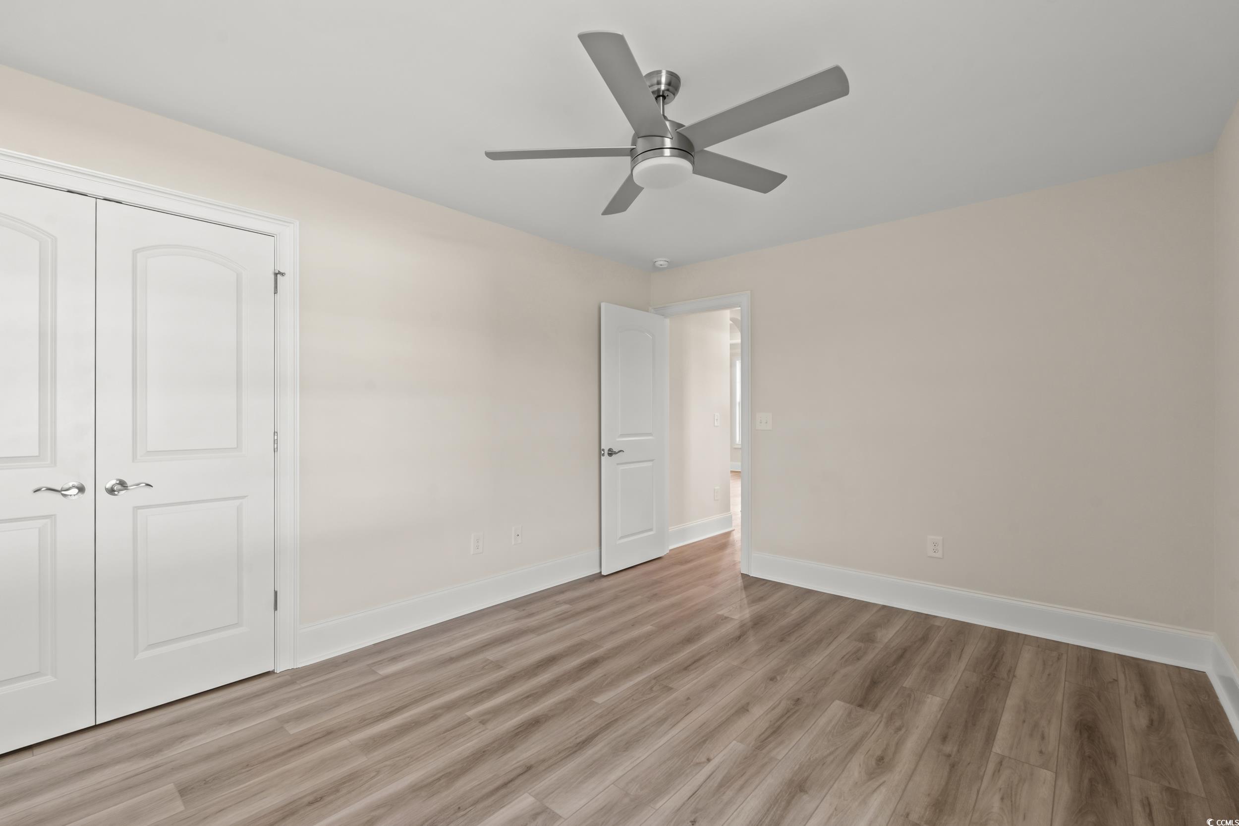4022 Macks Road Aynor, SC 29511 - Photo 17 of 35 Unfurnished bedroom featuring light wood-type flooring, baseboards, a closet, and a ceiling fan