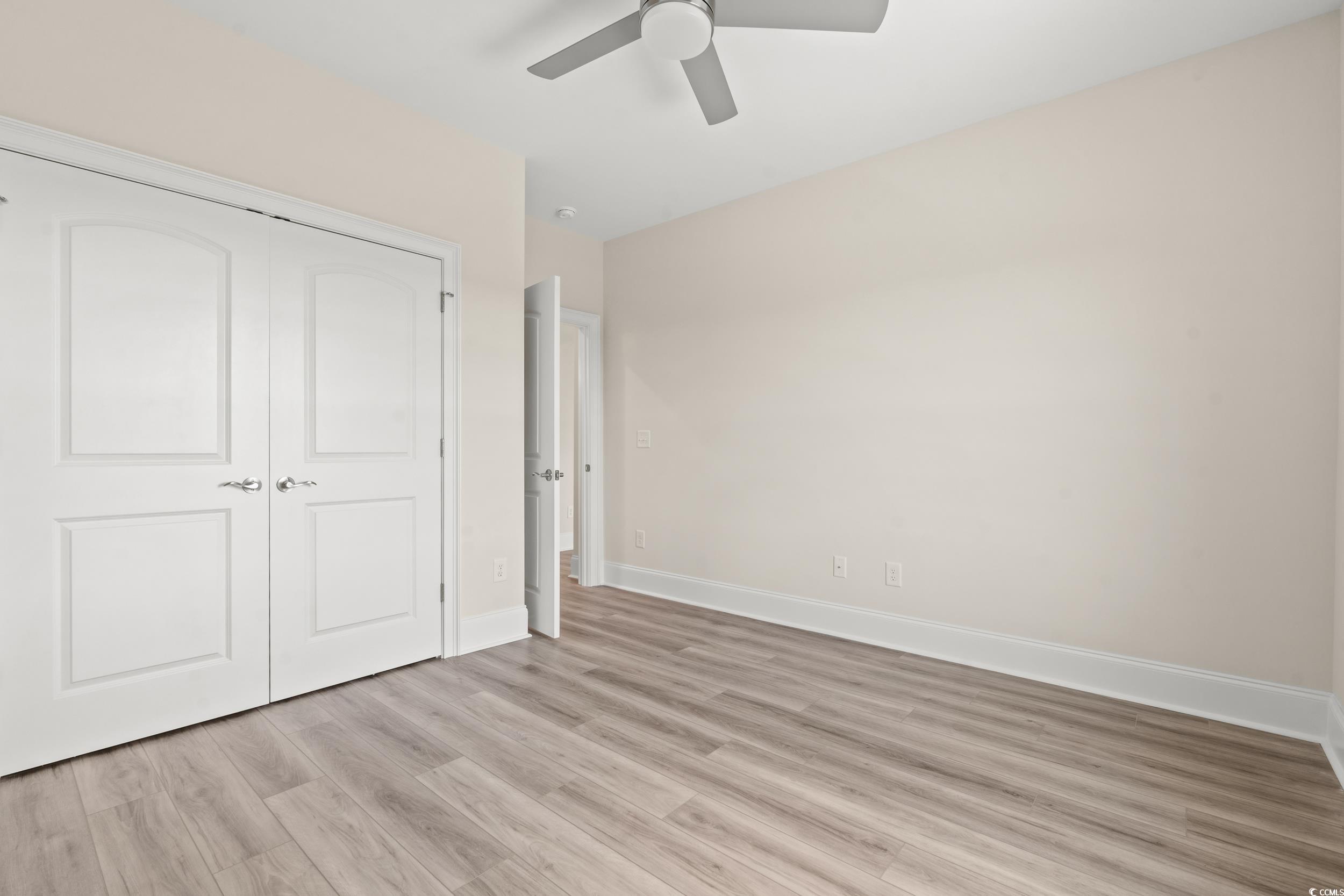 4022 Macks Road Aynor, SC 29511 - Photo 20 of 35 Unfurnished bedroom with light wood-style floors, baseboards, a closet, and ceiling fan