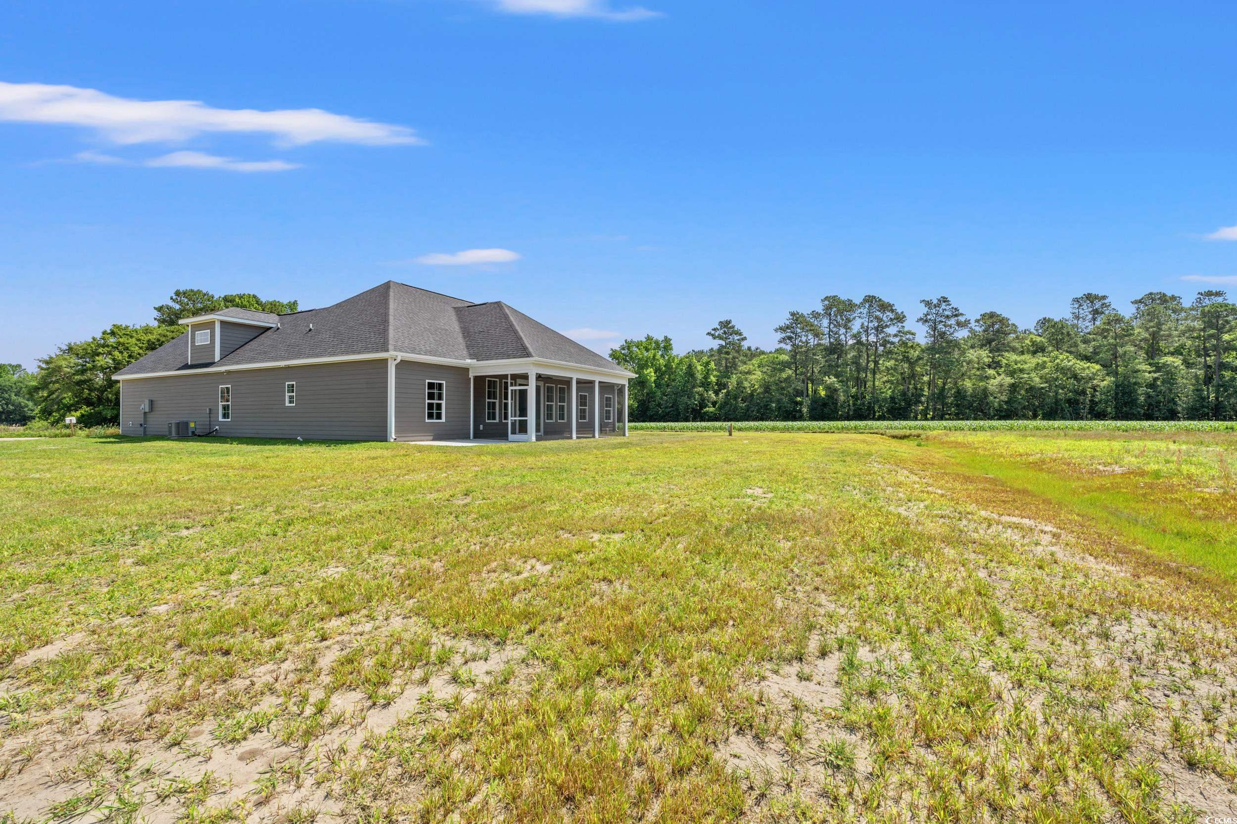 4022 Macks Road Aynor, SC 29511 - Photo 22 of 35 View of grassy yard featuring a sunroom