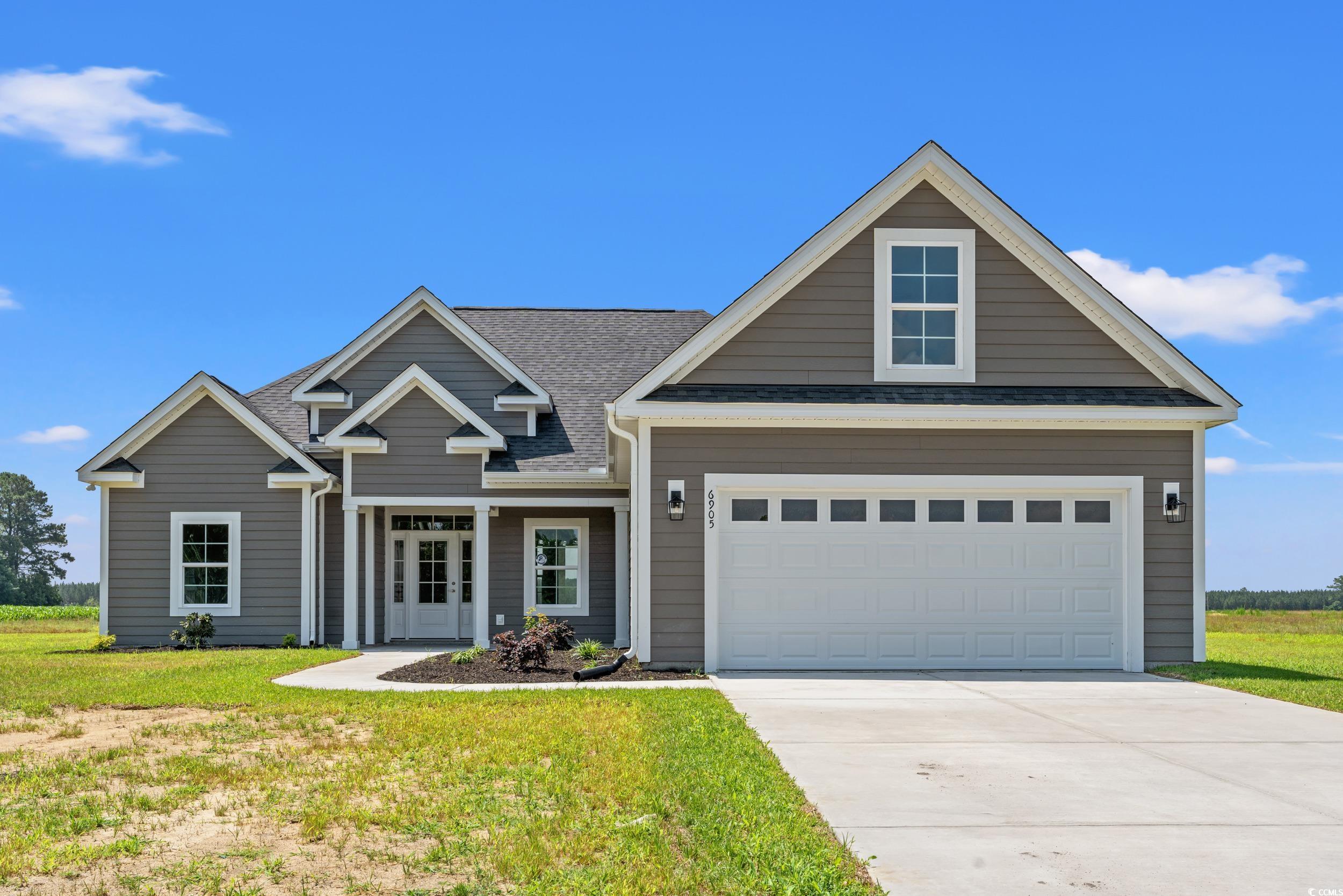 4022 Macks Road Aynor, SC 29511 - Photo 28 of 35 View of front facade with driveway, a front lawn, and roof with shingles
