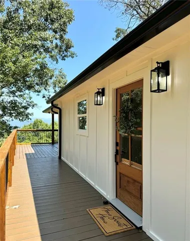a view of a balcony with wooden floor
