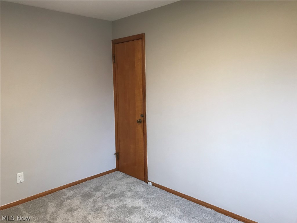 6564 Ridgewood Lakes Drive Parma, OH 44129 - Photo 22 of 33 Second bedroom with door leading to the unfinished 2nd floor